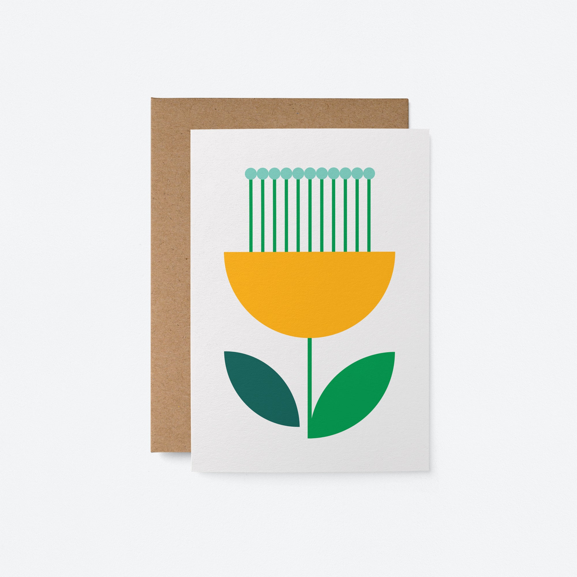 Flower No 31 greeting card with a yellow and green flower design on a white background, paired with a kraft envelope.