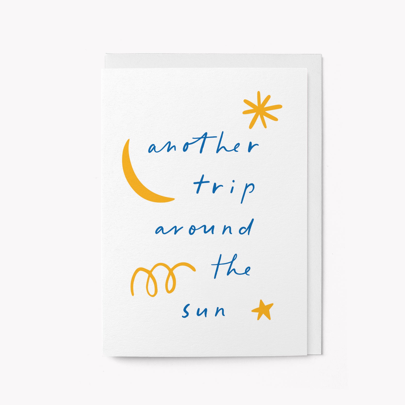 Birthday card with 'another trip around the sun' text and celestial symbols on a white background