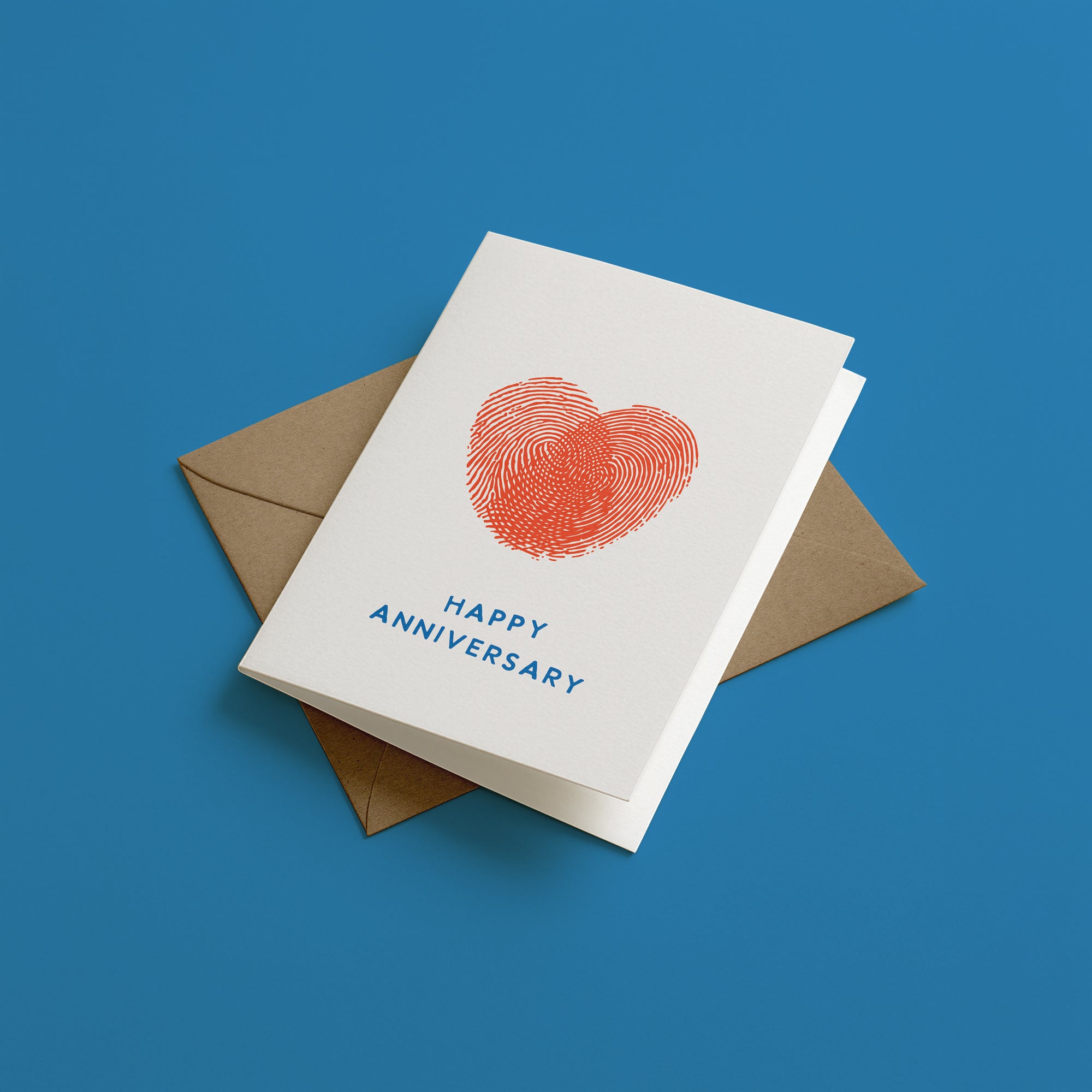 Greeting card with fingerprints heart design and 'Happy Anniversary' text on a blue background