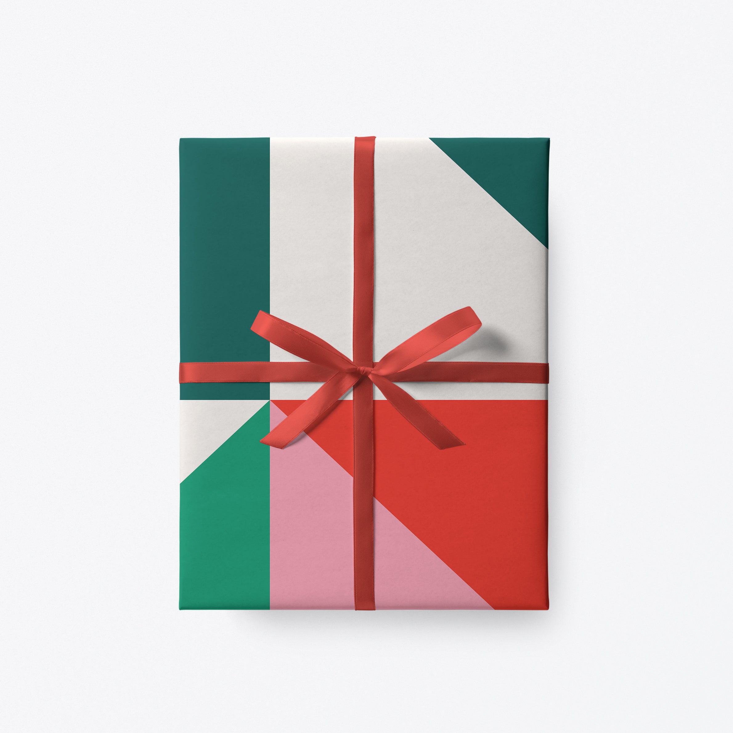 Geometric Christmas gift wrap with red, pink and green triangles by Graphic Factory.