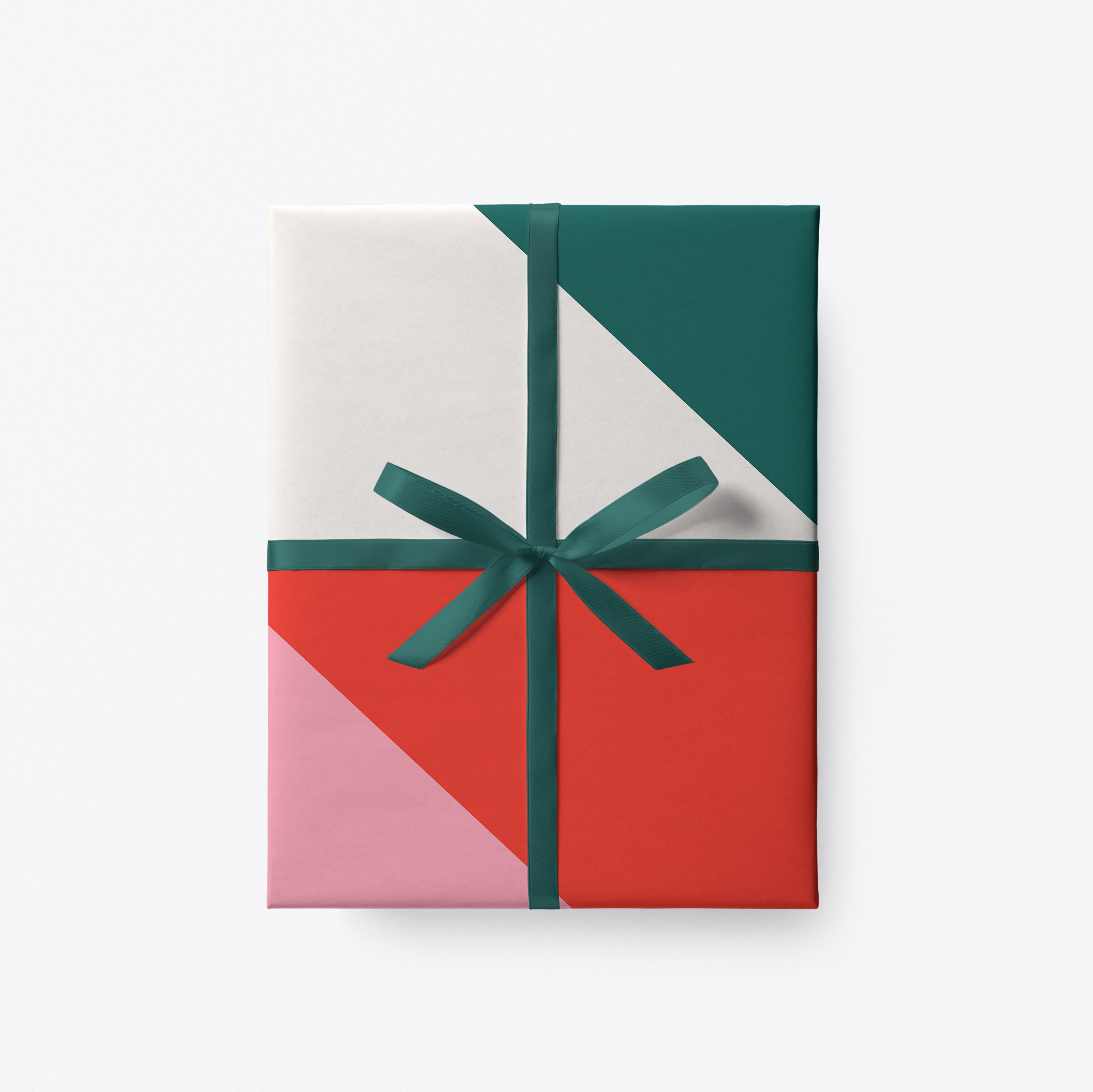 Geometric Christmas gift wrap with red, pink and green triangles by Graphic Factory.