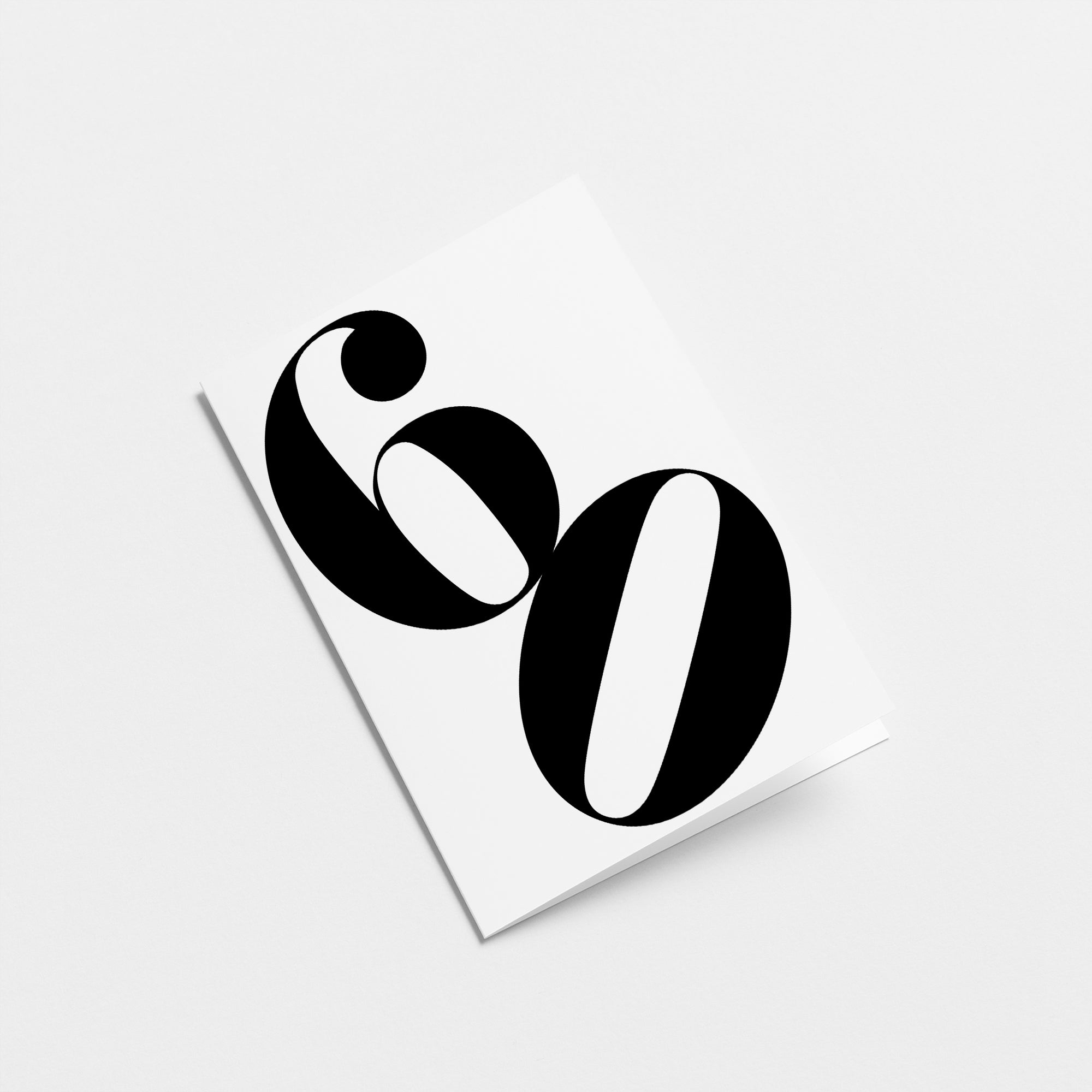 white 60th milestone age card with black number 60 Edit alt text