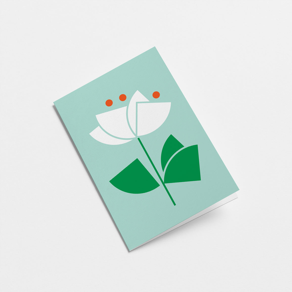 everyday greeting card with a white flower and green leafs Edit alt text