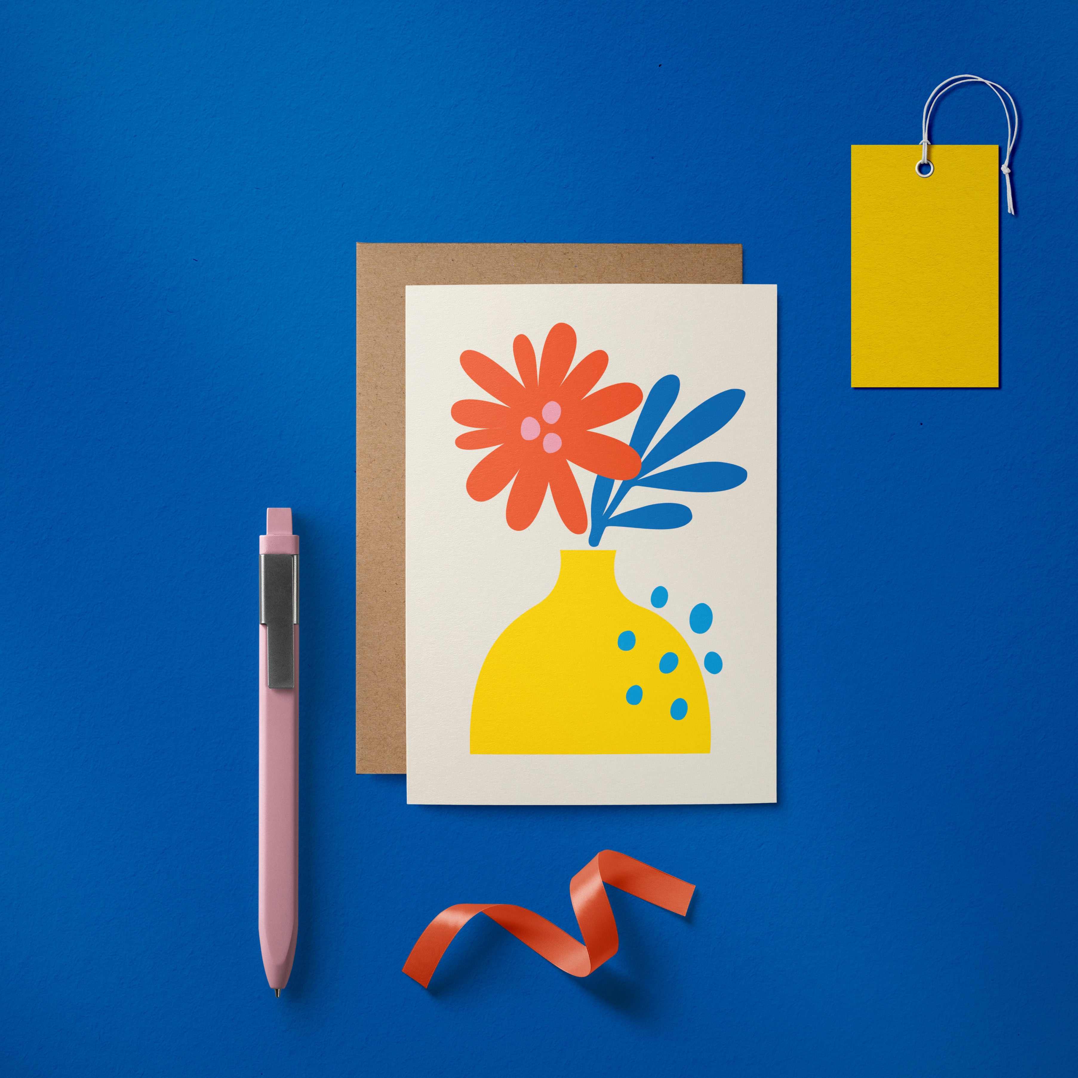 Greeting card with red and blue flowers and yellow vase Edit alt text