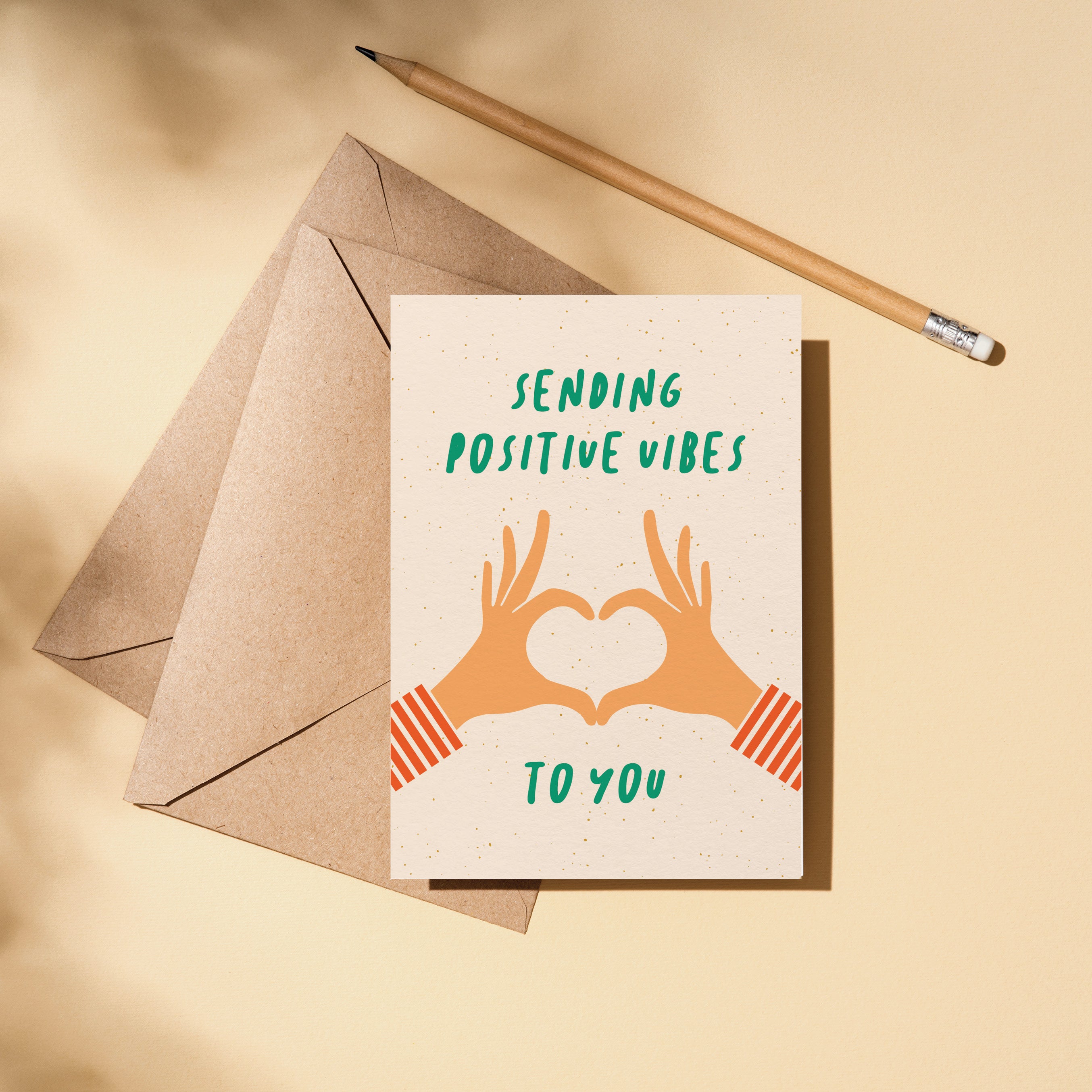 greeting card with two hands creating heart shape with fingers and a text that says sending positive vibes to you Edit alt text