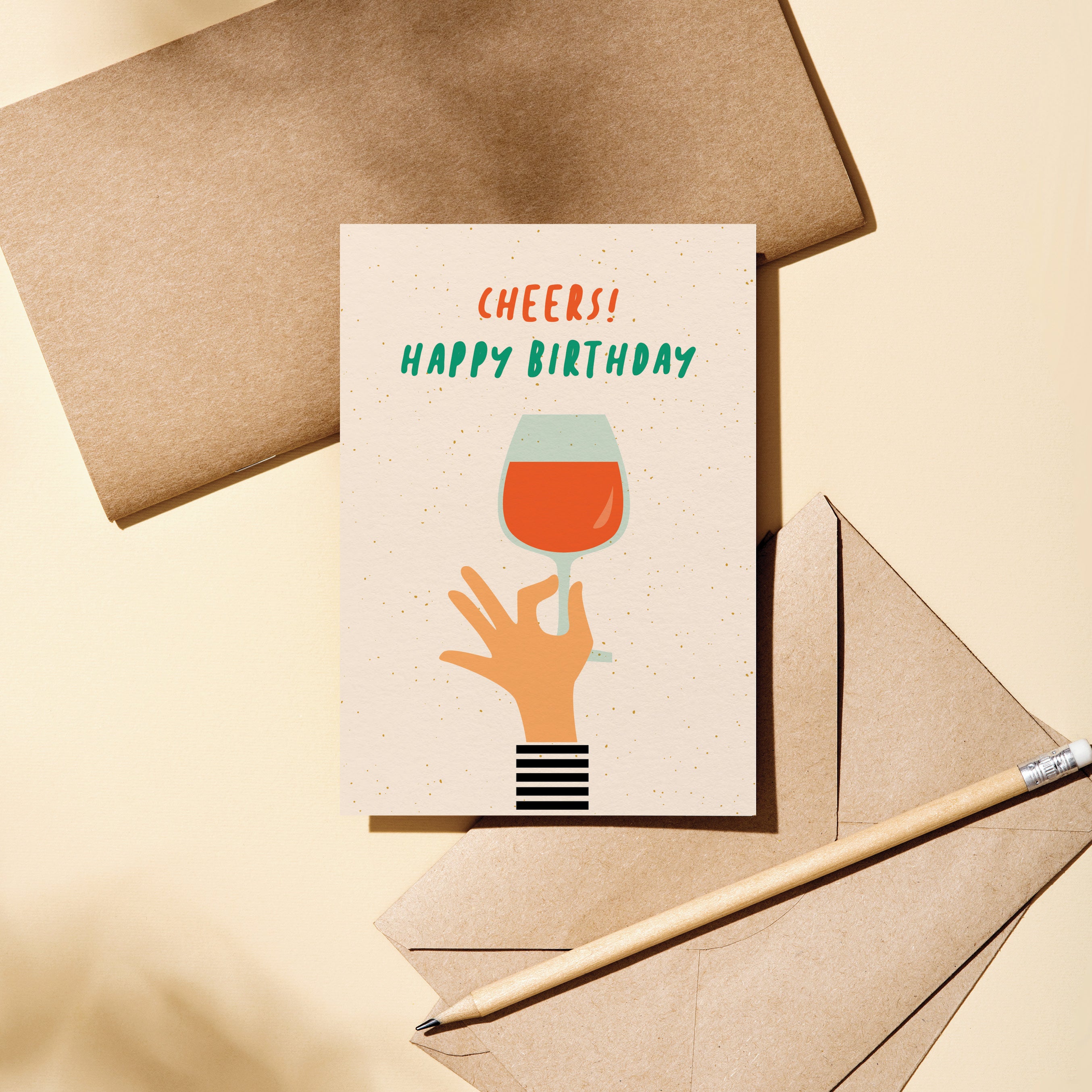 Birthday card with a hand holding a glass of wine and a text that says Cheers! Happy Birthday Edit alt text