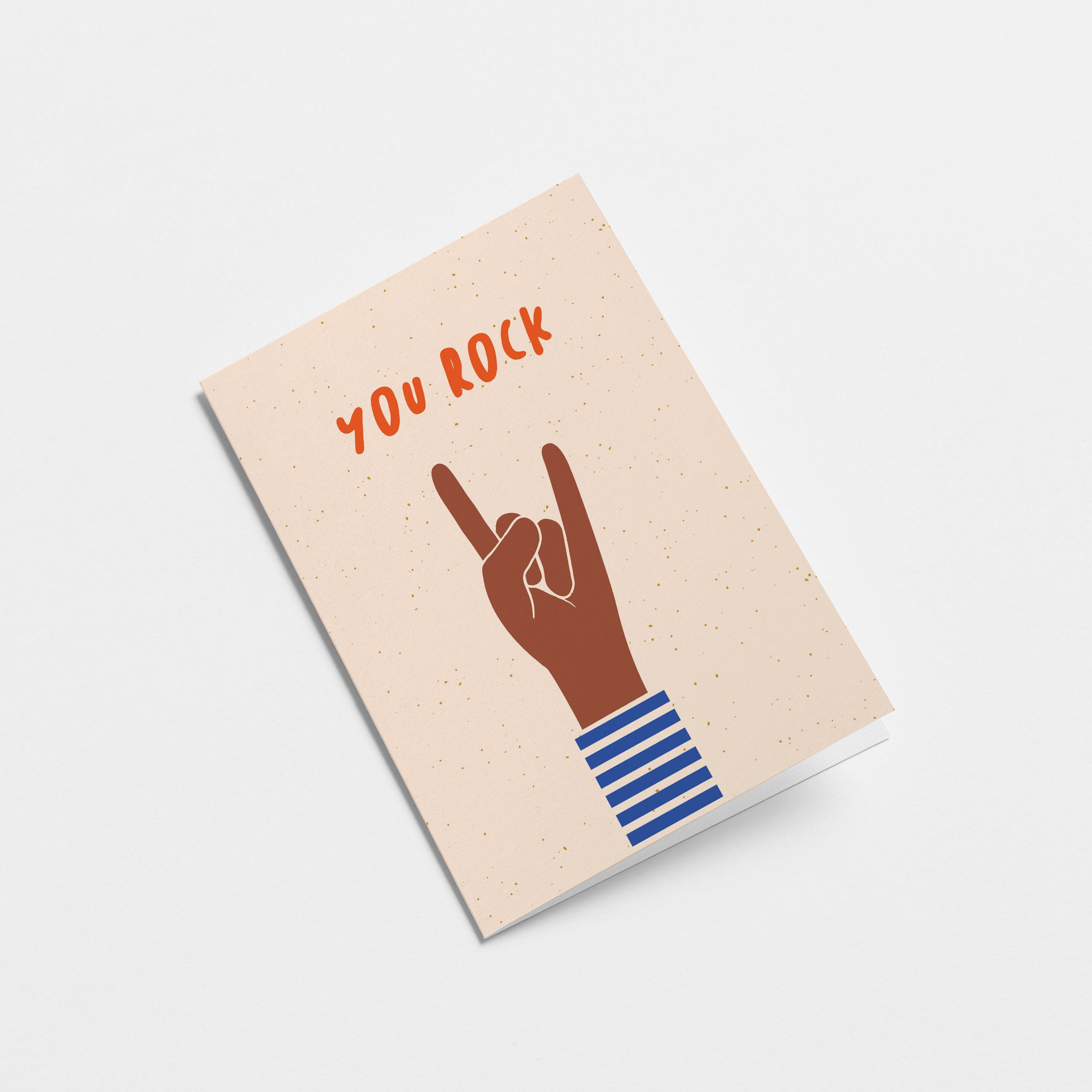 birthday card with a brown hand and a gesture of sign of the horns with a text that says you rock Edit alt text