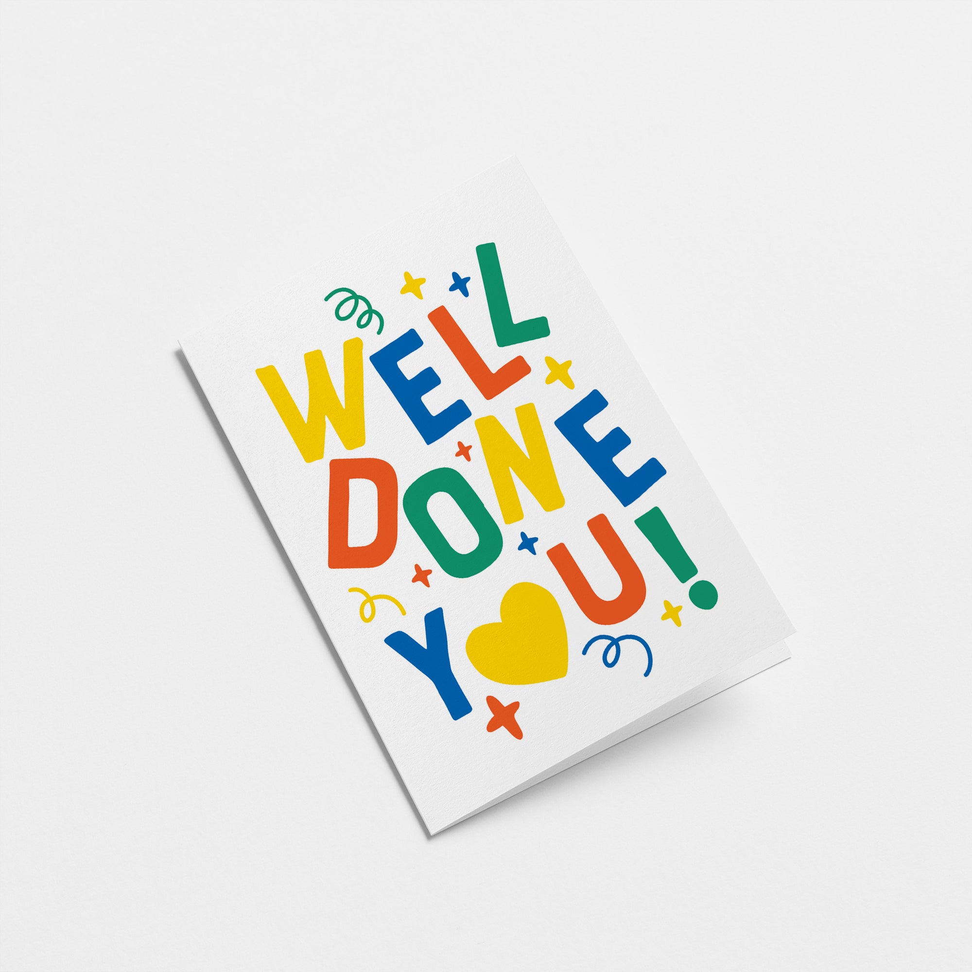 Congratulations graduation card with turned down letters with a text of well done you! Edit alt text