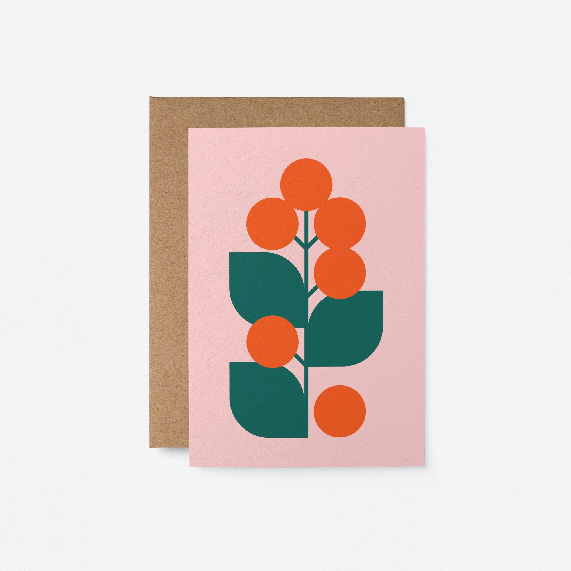 Flower No 27 greeting card with vibrant orange flowers and green leaves on a soft pink background, paired with a kraft envelope – ideal for Christmas, holiday greetings, and general celebrations.