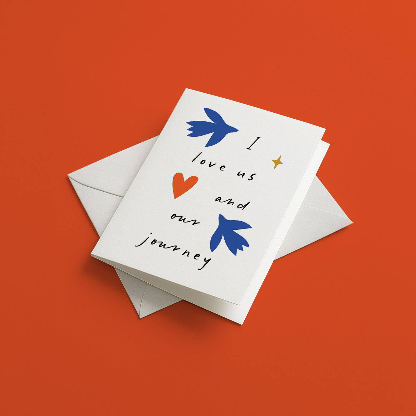 Greeting card with couple birds design and text on an orange background