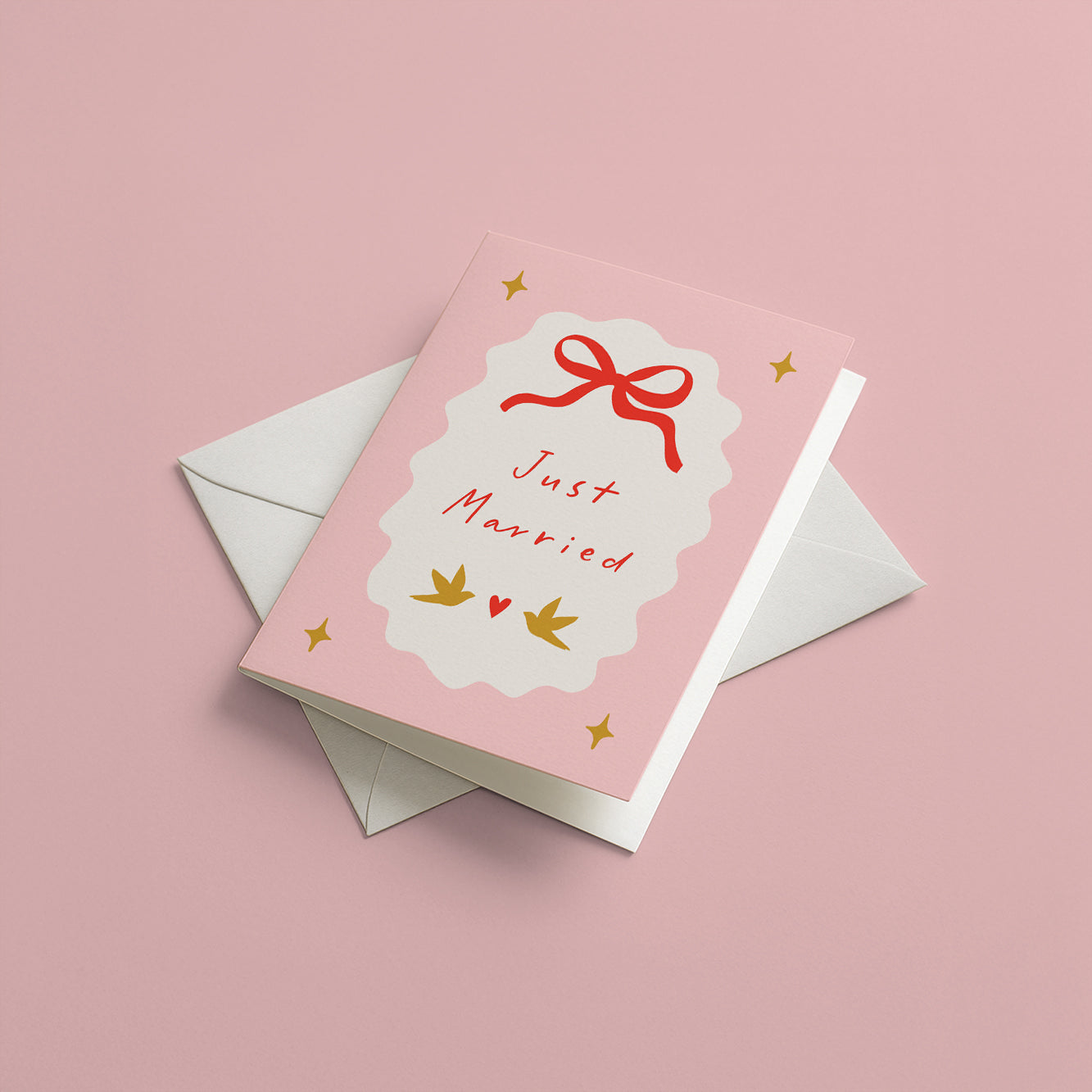 Greeting card with 'Just Married' text and a bow on a pink background