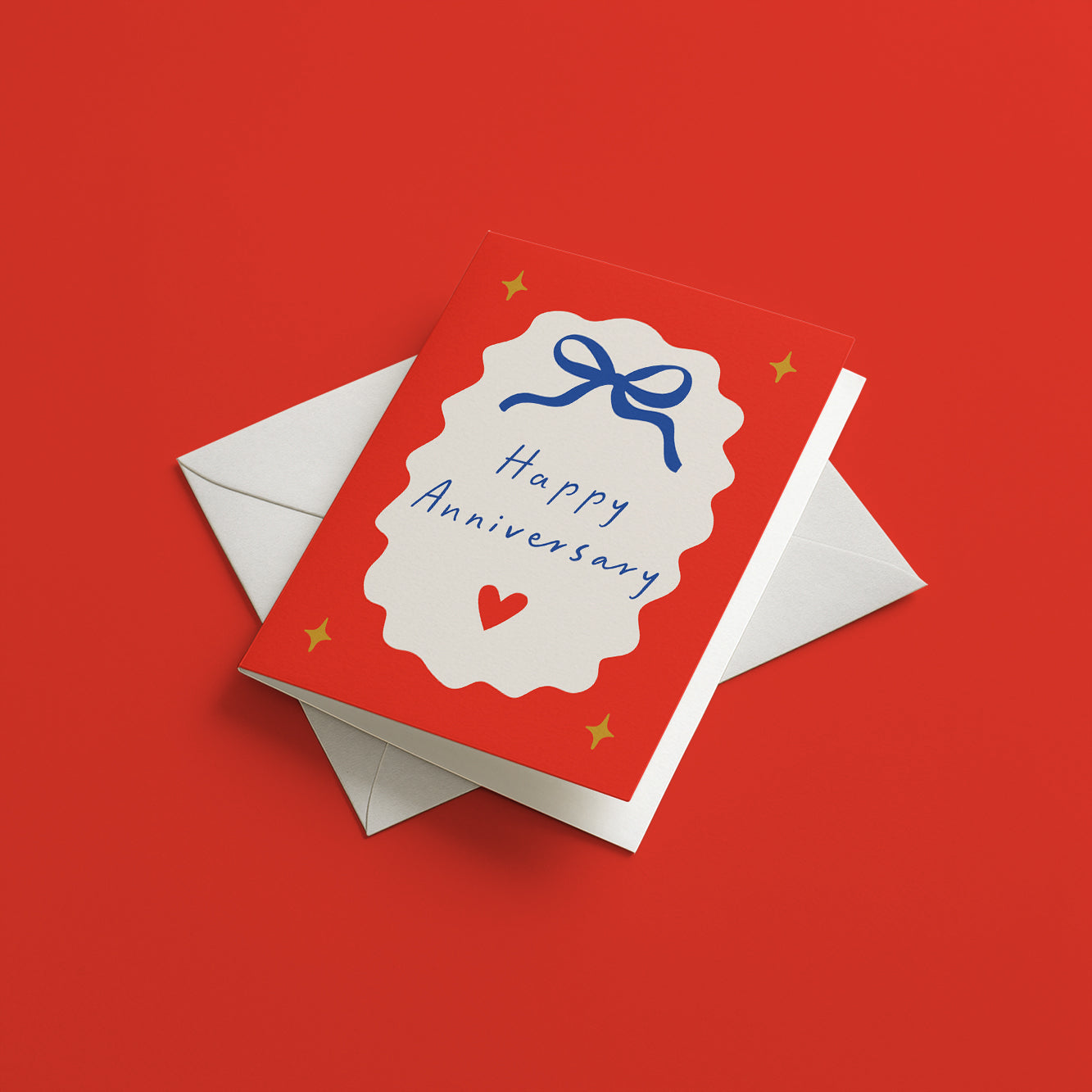 Greeting card with 'Happy Anniversary' text on a red background