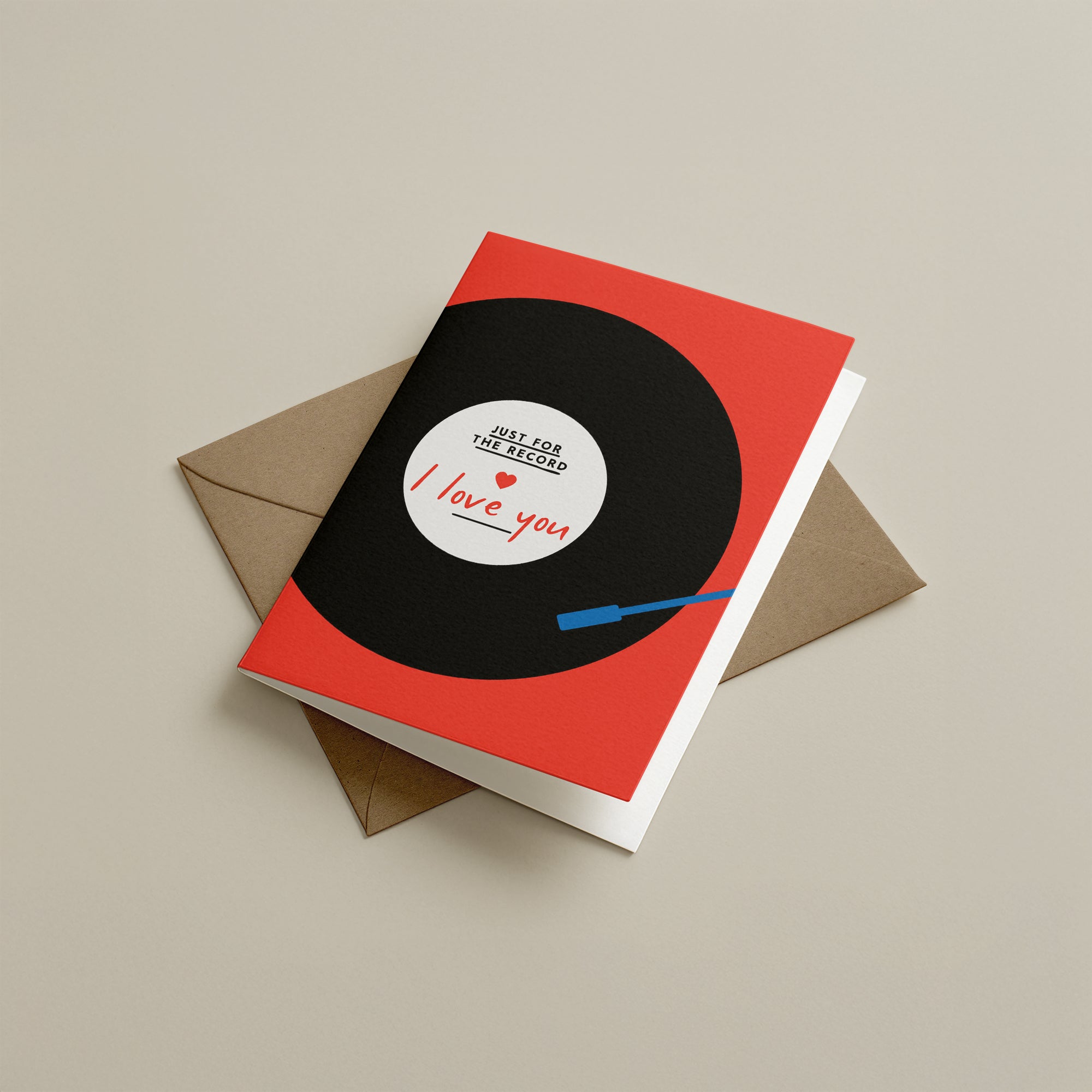 Greeting card with vinyl record design and envelope on a beige background