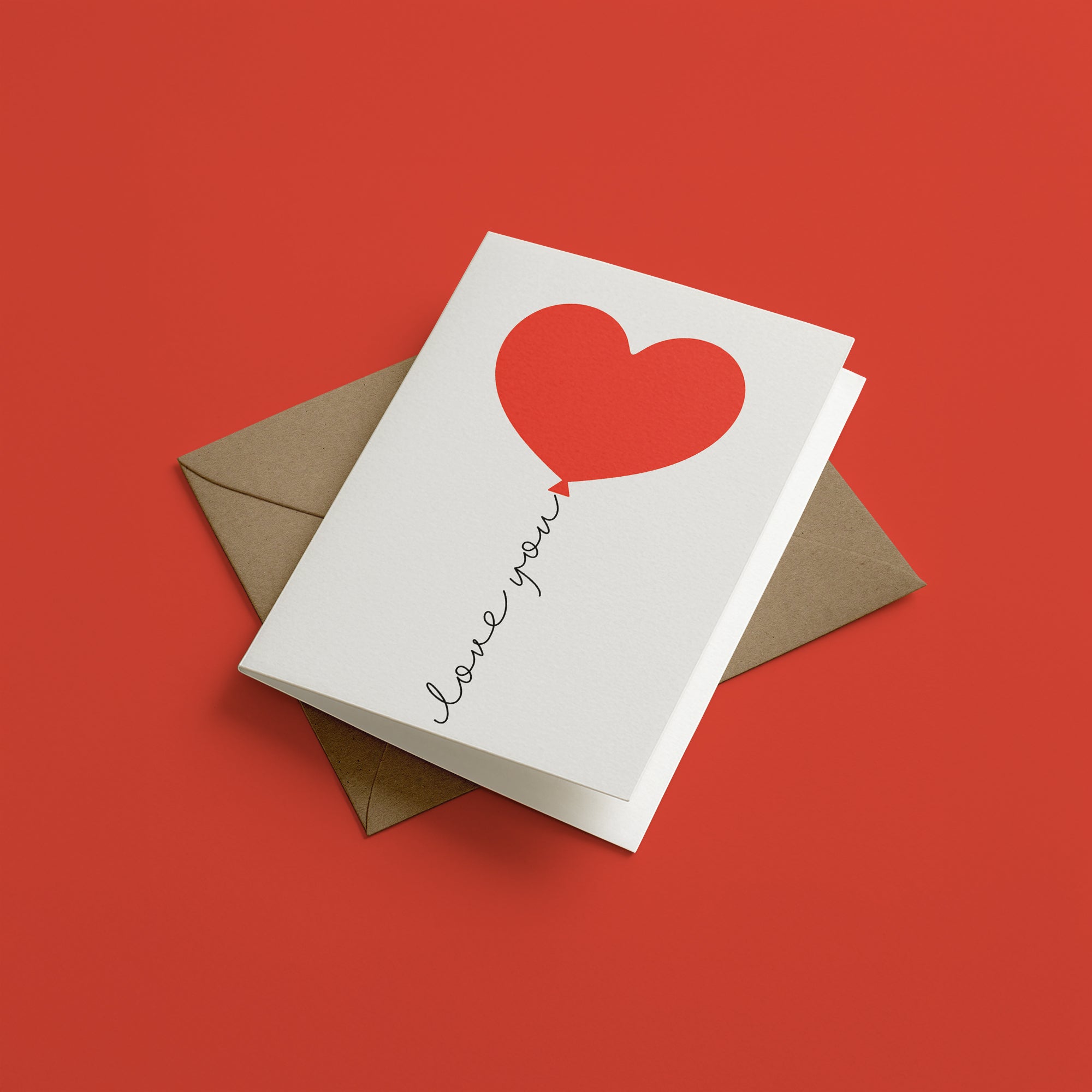 Greeting card with heart balloon design and 'love you' text on a red background