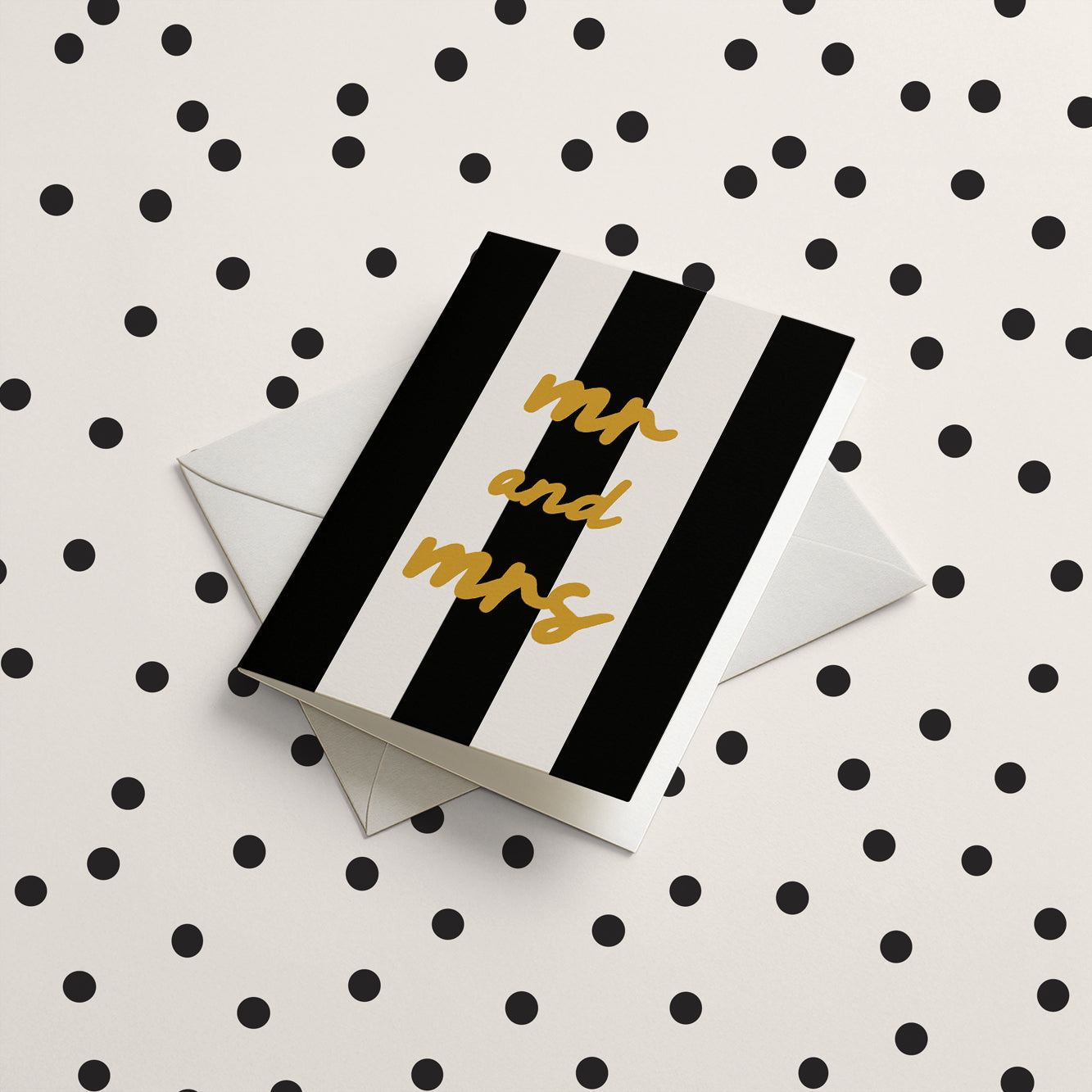 Black and white striped card with 'mr and mrs' text on a polka dot background
