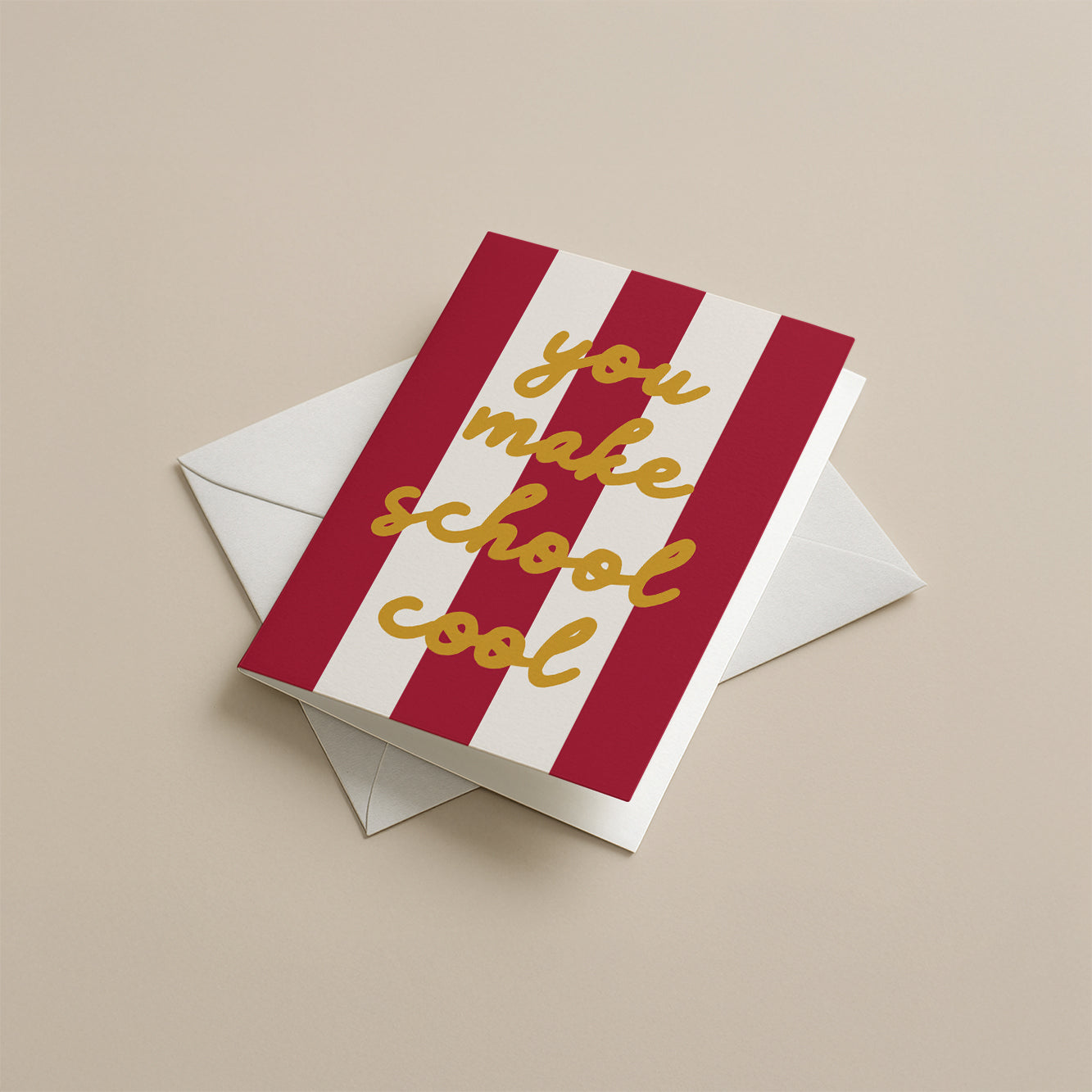 Burgundy and white striped card with 'you make school cool' text on a beige background