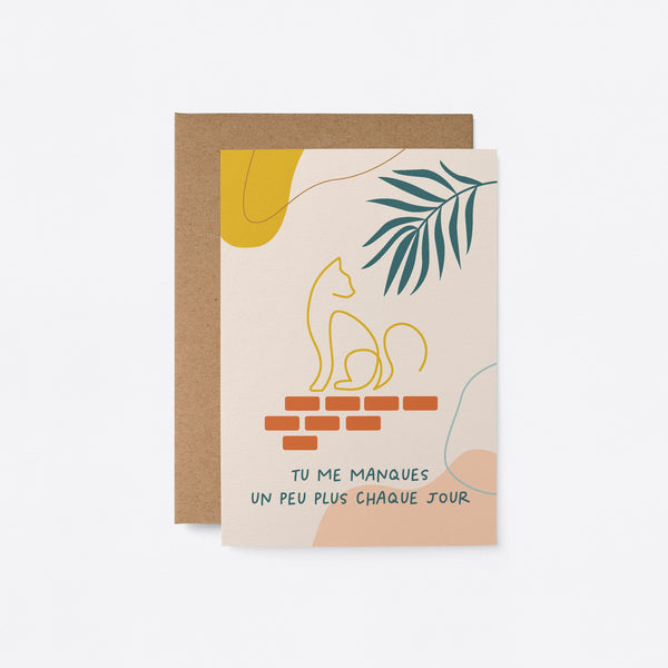 French friendship card with green leaf and a yellow cat drawing on with a text that says Tu me manques un peu plus chaque jour