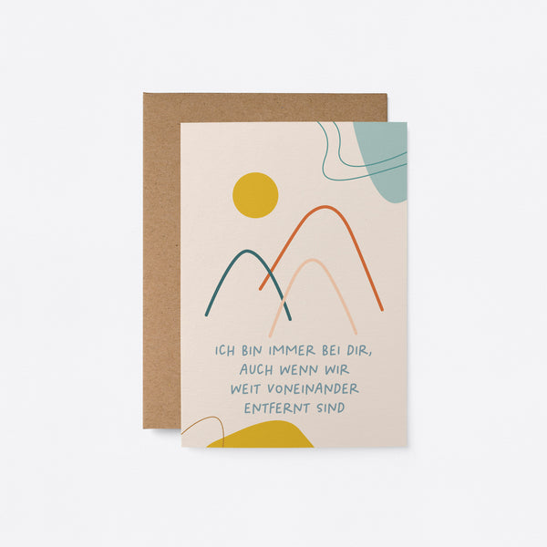 German thinking of you card with mountain drawings and a yellow sun and a text that says Ich bin immer bei dir, auch wenn wir weit voneinander entfernt sind