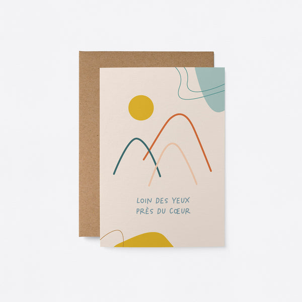 French thinking of you card with mountain drawings and a yellow sun and a text that says Loin des yeux, près du cœur