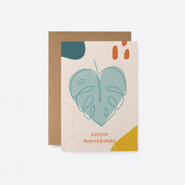 French Birthday card with a heart shaped green leaf and a text that says Joyeux anniversaire