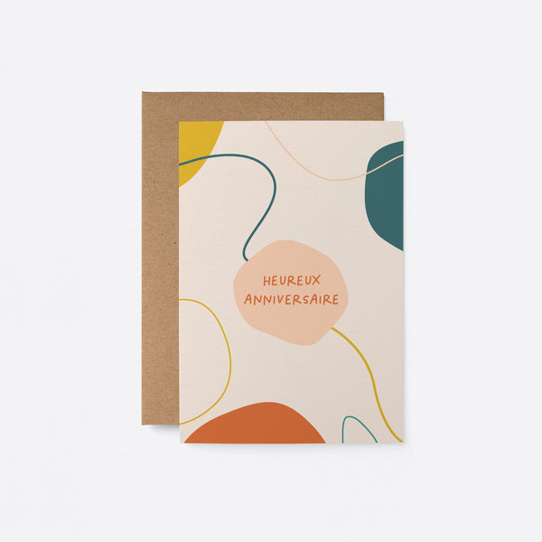 French birthday card with colorful shapes and figures and a text that says Heureux anniversaire