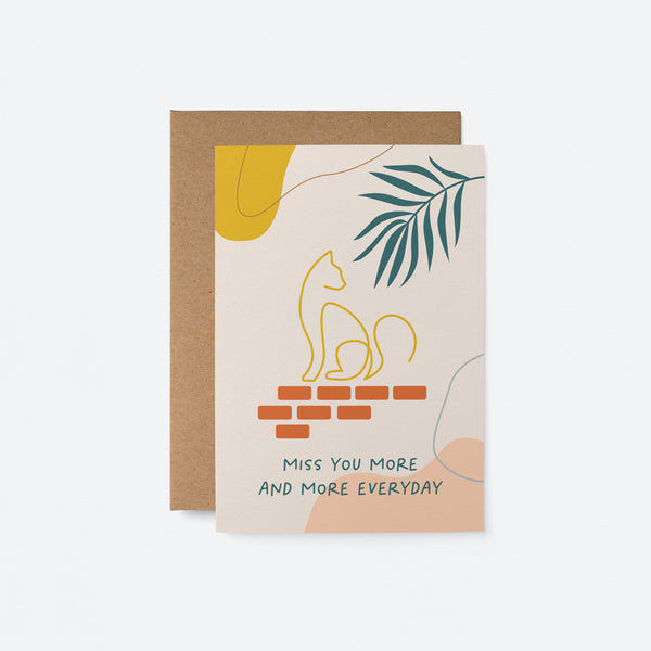 friendship card with green leaf and a yellow cat drawing on with a text that says Miss you more and more everyday