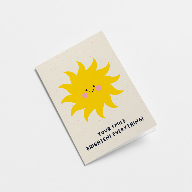 Love greeting card with a yellow sun with a smiley face and a text that says your smile brightens everything