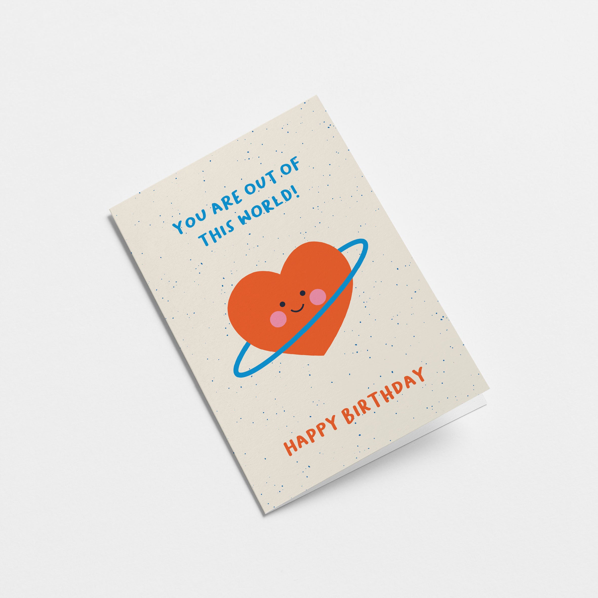 Birthday greeting card with a red heart shaped planet and a text that says you are out of this world happy birthday