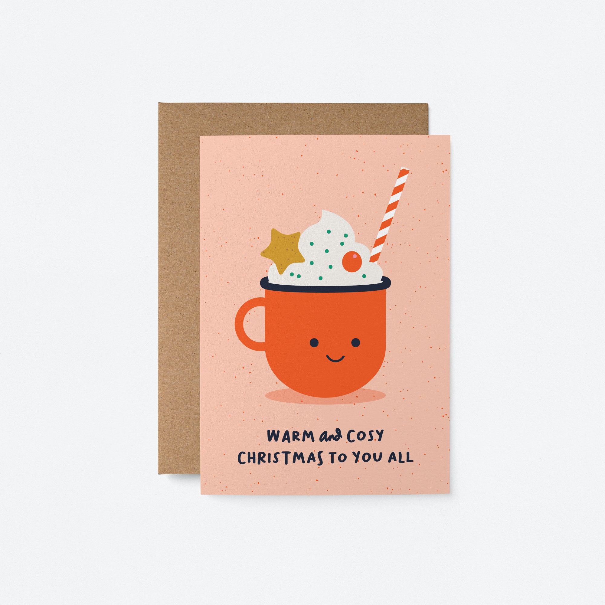 christmas card with a red cup full of white cream and decorations and a text that says warm and Cosy Christmas to you all