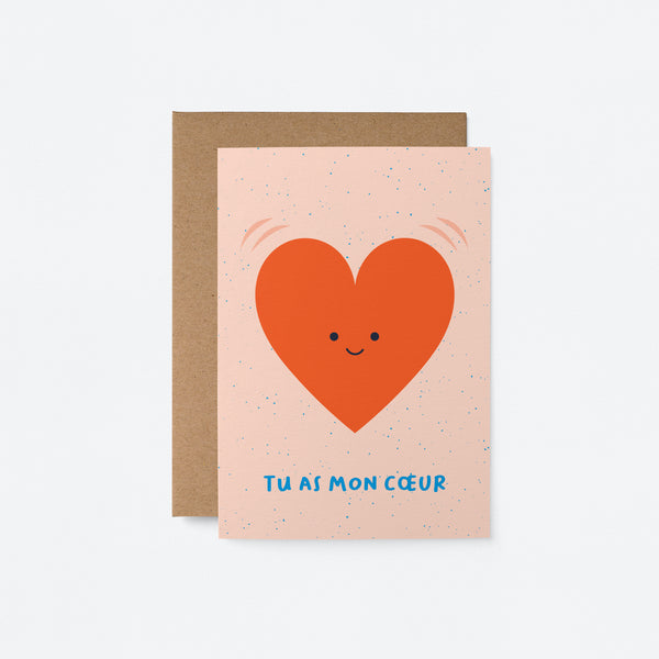 French Love card with a red heart shape with a smiley face and a text that says Tu as mon cœur