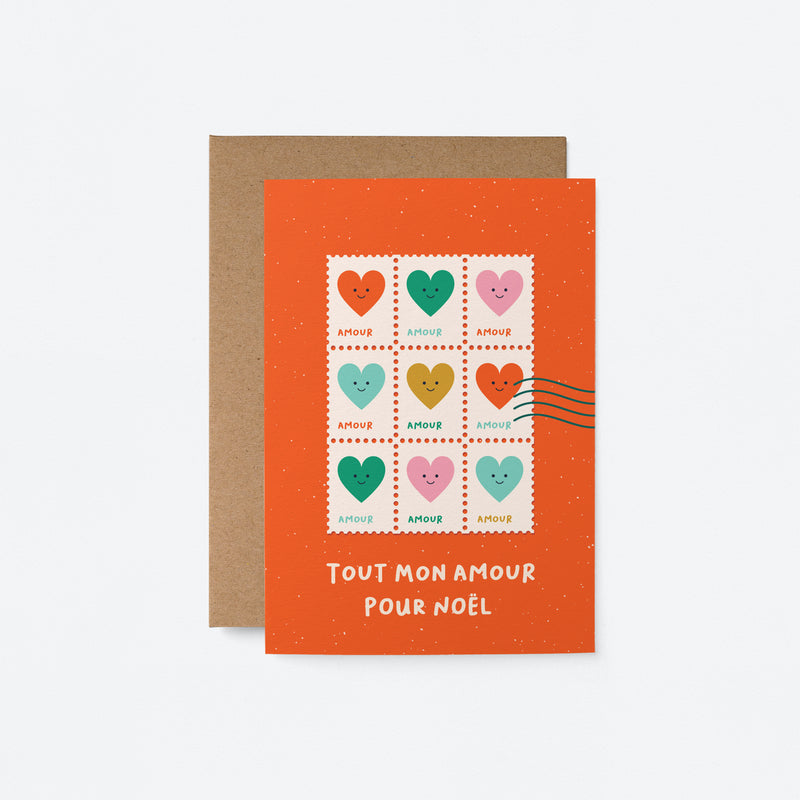 French christmas greeting card with colorful heart shaped letter stamps and a text that says Tout mon amour pour Noël