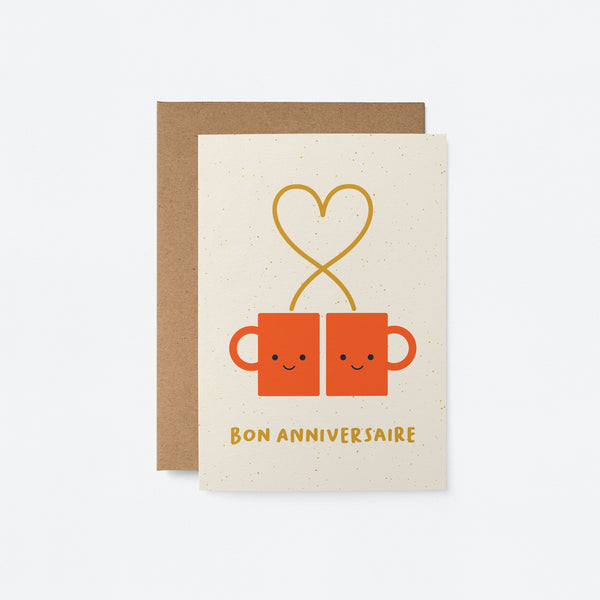 french anniversary card with two red coffee cups and a heart shape with a text that says Bon anniversaire