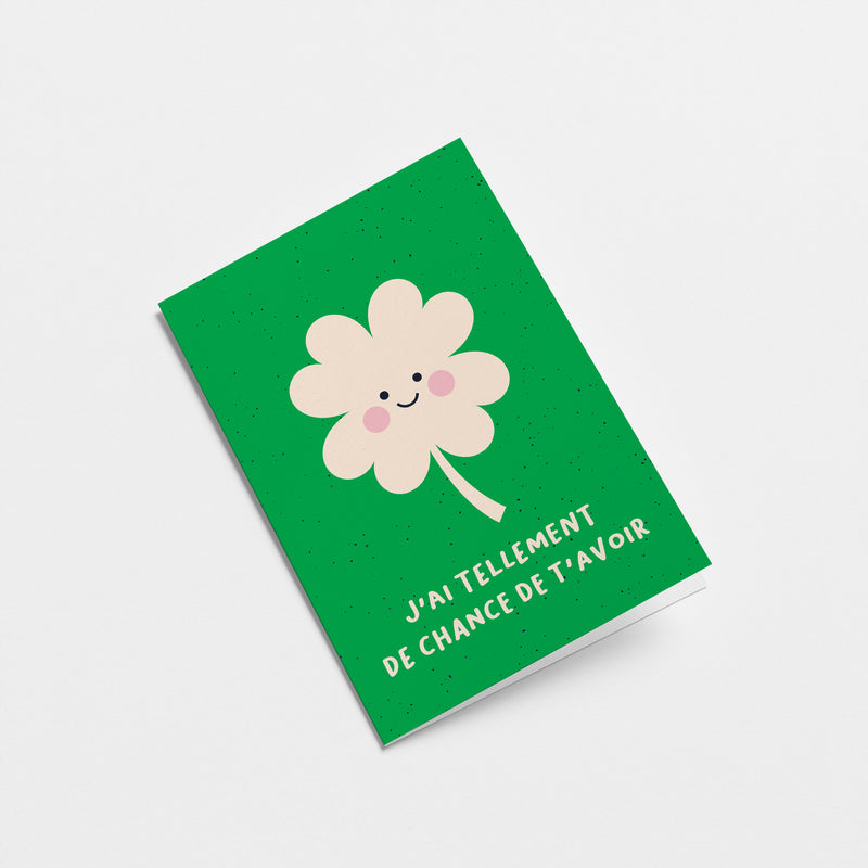 French Love card with a white clover with a smiley face and a text that says J’ai tellement de chance de t’avoir  Edit alt text