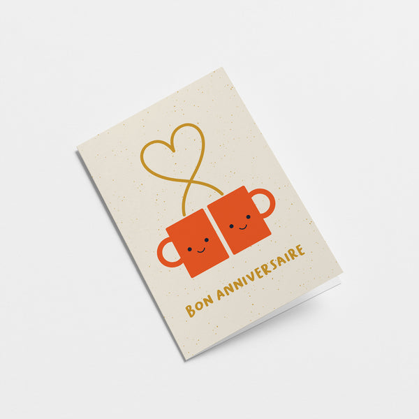 french anniversary card with two red coffee cups and a heart shape with a text that says Bon anniversaire  Edit alt text