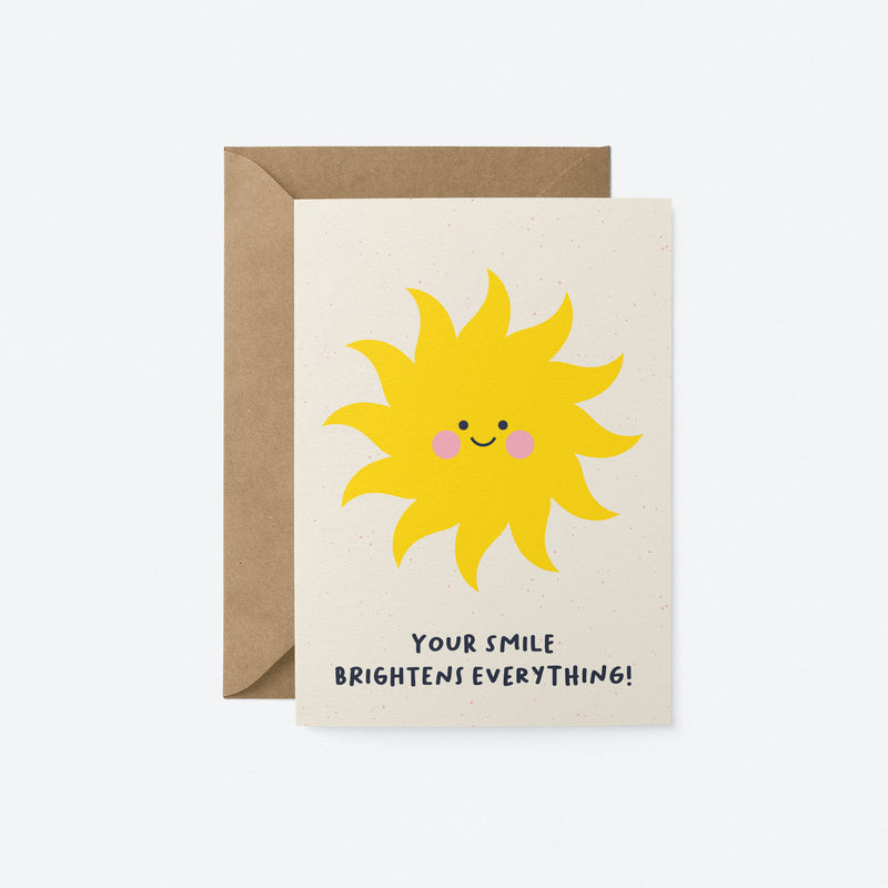 Love greeting card with a yellow sun with a smiley face and a text that says your smile brightens everything