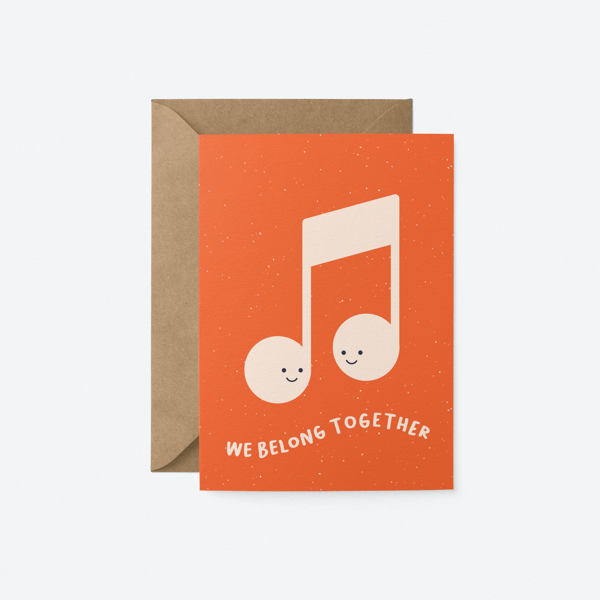 Love greeting card with musical note and a text that says we belong together