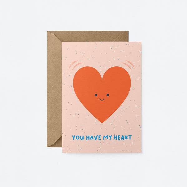 Love card with a red heart shape with a smiley face and a text that says you have my heart