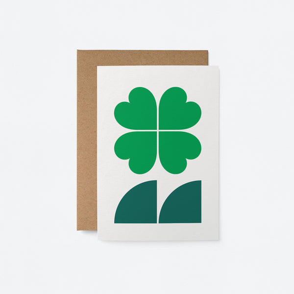 everyday greeting card with four leaf clover and dark green leafs