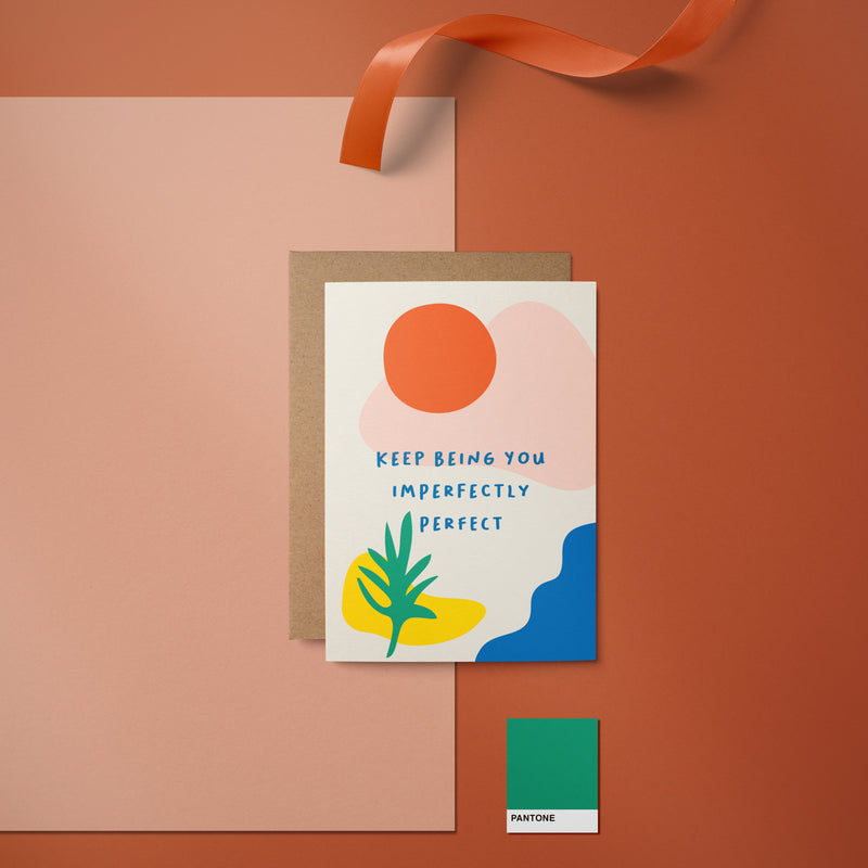 Love card with red sun, green plant, blue, pink and yellow figures and a text that says Keep being you imperfectly perfect  Edit alt text