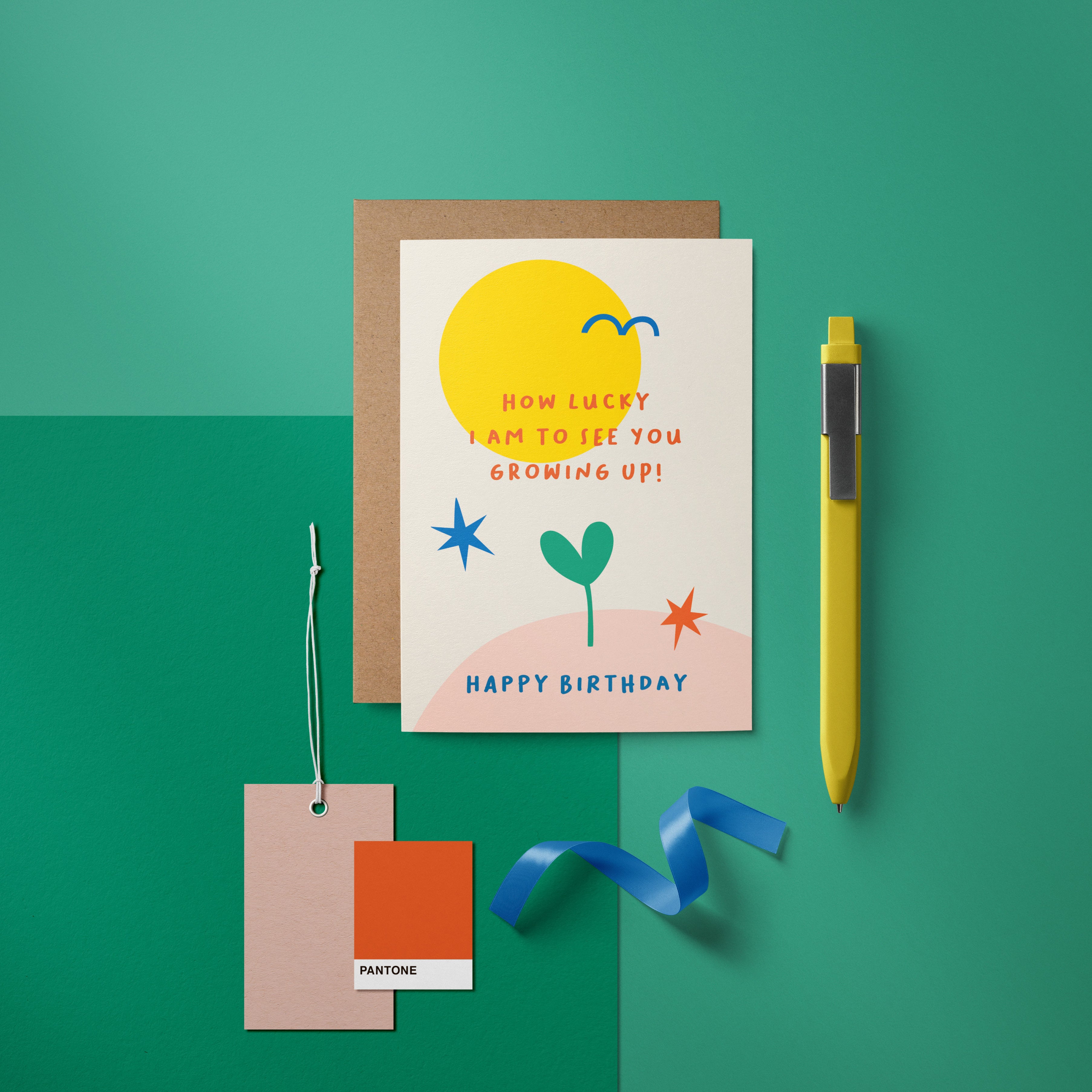 Birthday Card with yellow sun, blue bird, green plant, red and blue stars and a text that says How lucky I am to see you growing up  Edit alt text