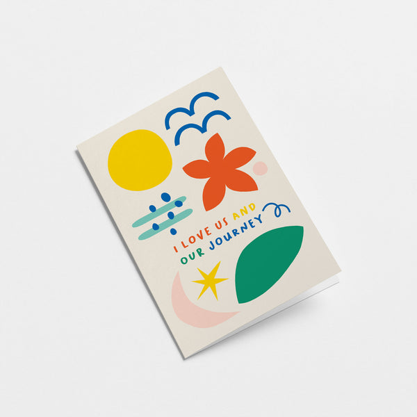 Love card with yellow sun, blue birds, red flower, green, pink, blue and yellow figures and a text that says I love us and our journey  Edit alt text