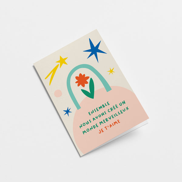 French Love card with red and green flower, blue, yellow and pink figures with a text that says Ensemble, nous avons créé un monde merveilleux. Je t’aime  Edit alt text