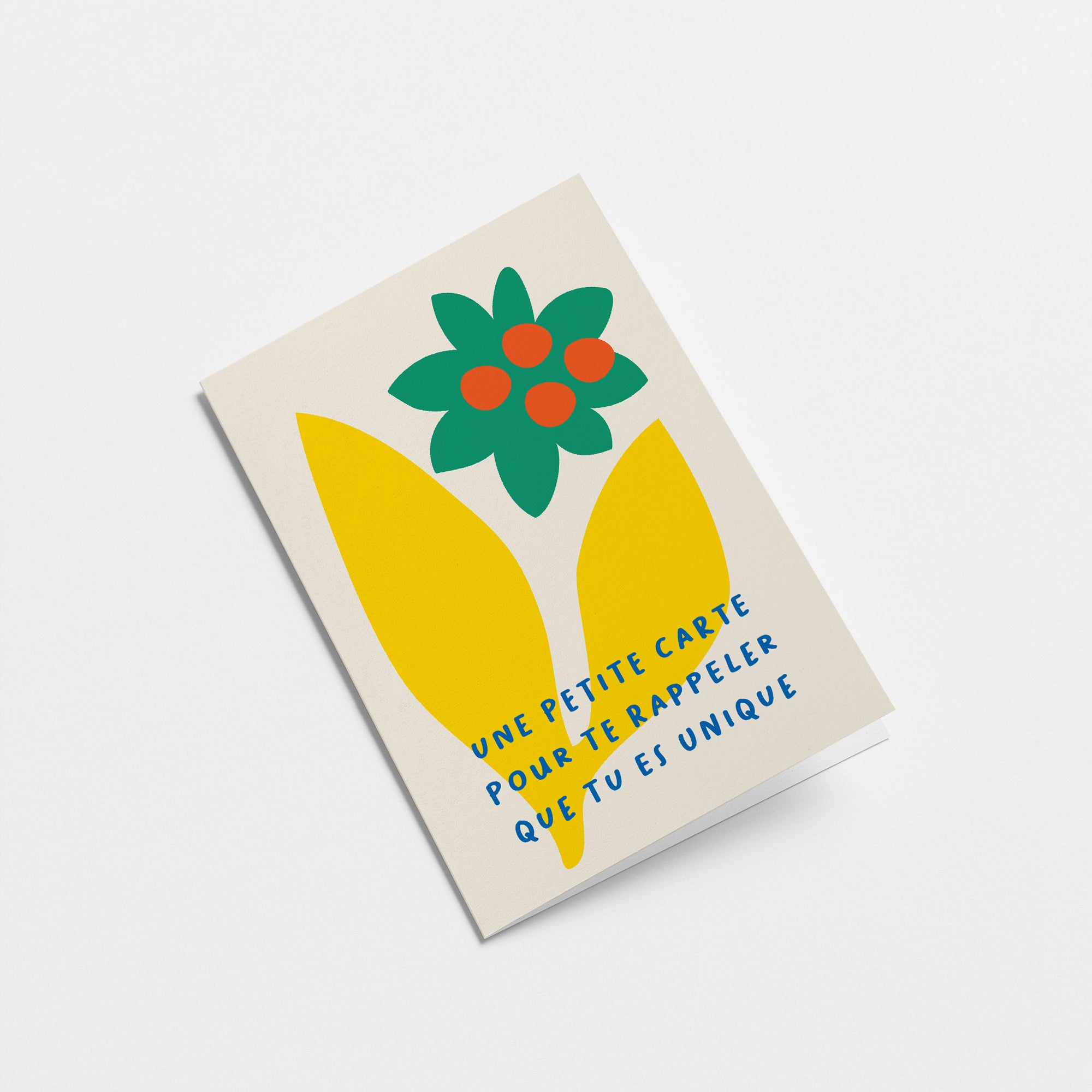 French Love card with yellow leafs, green and red flower and a text that says Une petite carte pour te rappeler que tu es unique  Edit alt text