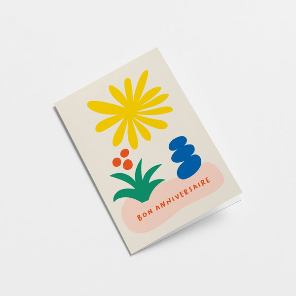 French Friendship card with yellow sun figure, green and red flower, blue figure and a text that says Bon anniversaire  Edit alt text