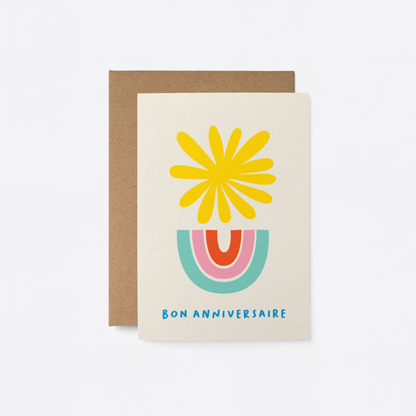 French Birthday card with a yellow sun and blue, pink, red rainbow and a text that says Bon anniversaire