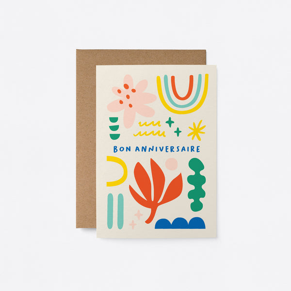 French Birthday card with rainbow, red flower, pink,red,yellow,green,blue figures and a text that says Bon anniversaire