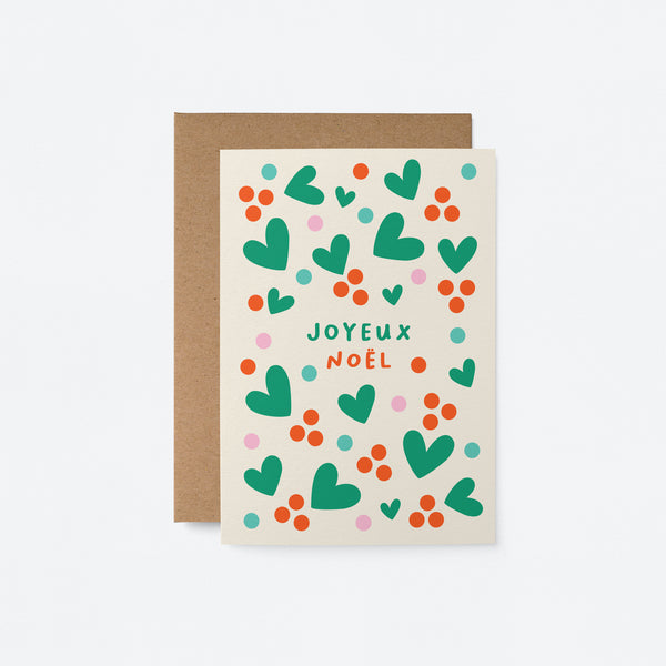 French Christmas card with green heart shapes, red dots and a text that says Joyeux et lumineux