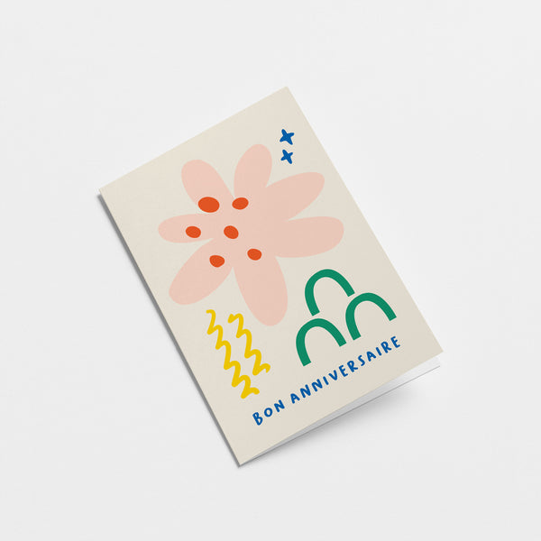 French birthday card with pink, red, yellow, green and blue figures and a text that says Bon anniversaire  Edit alt text
