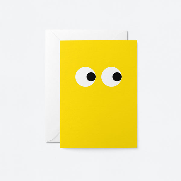 yellow greeting card with side-eyeing eyes
