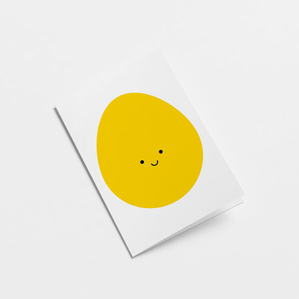 easter card with a yellow egg with a smiley face  Edit alt text